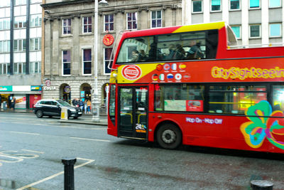 Red car on city street