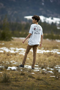 Man standing on field during winter