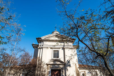 Low angle view of built structure against blue sky