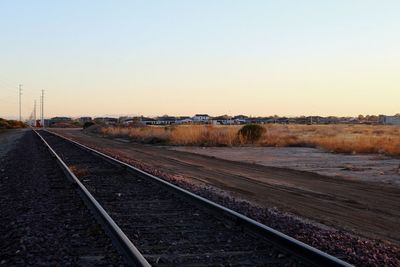 Railroad tracks against clear sky