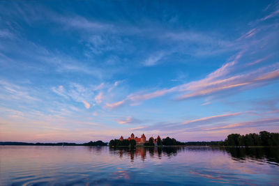 Scenic view of lake against sky during sunset