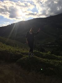 Full length of man standing on land against sky