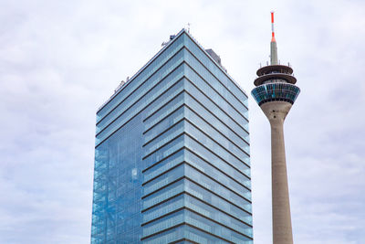 Low angle view of building against cloudy sky