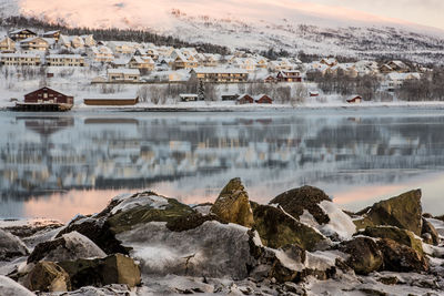 Scenic view of lake against sky during winter