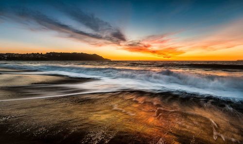 Scenic view of sea against sky during sunset