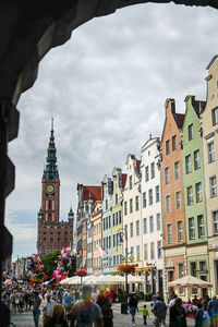 Group of people in front of buildings in city