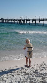 Full length of man standing on beach