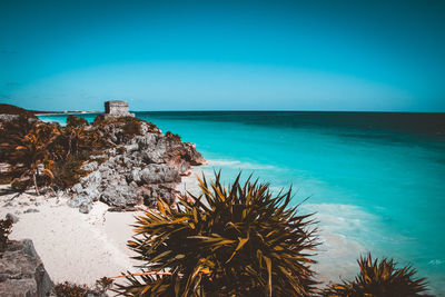 Scenic view of sea against blue sky