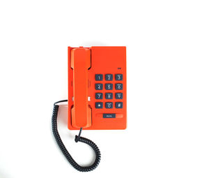 Close-up of telephone booth against white background