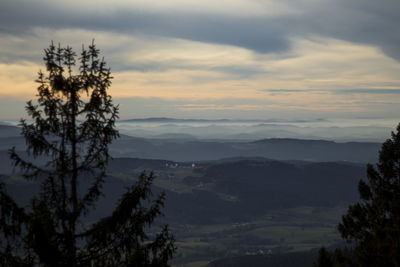 Scenic view of mountains against sky at sunset