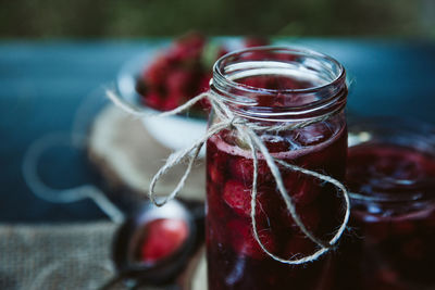 Close-up of drink in glass jar on table