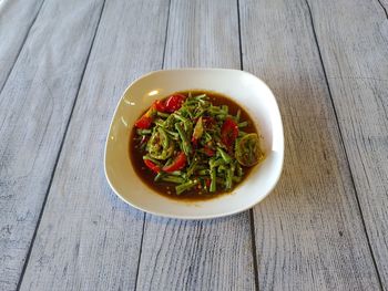 High angle view of salad in bowl on table