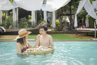 Side view of woman in swimming pool