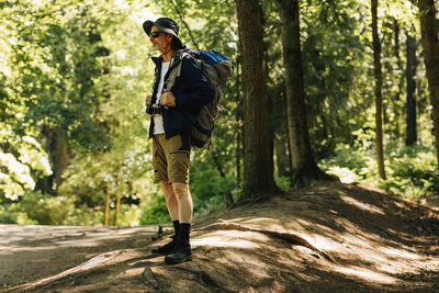 Full length of man walking in forest