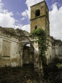 Low angle view of old building against sky