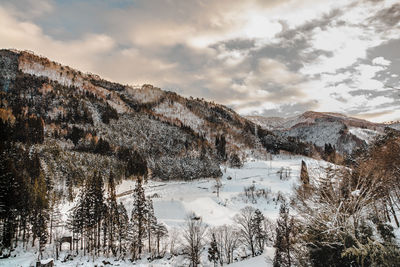 Scenic view of snowcapped mountains against sky