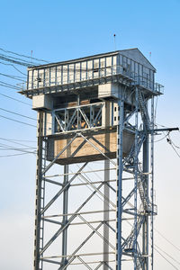 Tower of two-tier vertical lift bridge. bunk bridge in kaliningrad city. blue sky background