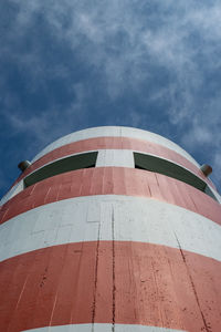 Low angle view of building against cloudy sky