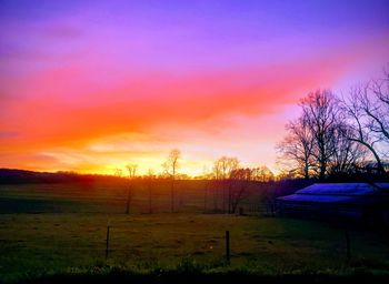 Scenic view of field against sky during sunset