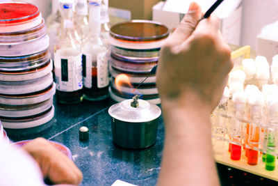 Close-up of person hands experimenting in laboratory