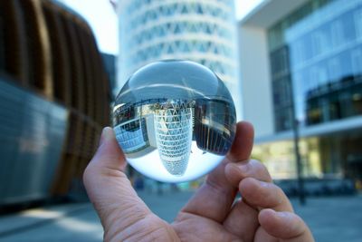 Cropped hand holding crystal ball