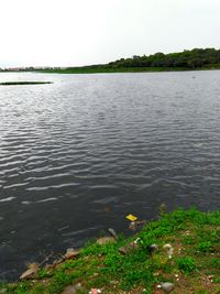 Scenic view of farm against sky