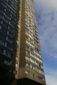 Low angle view of office building against sky