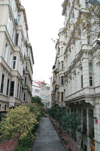 Street amidst buildings against sky