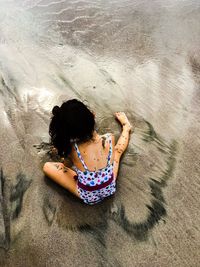 Girl playing in the beach 