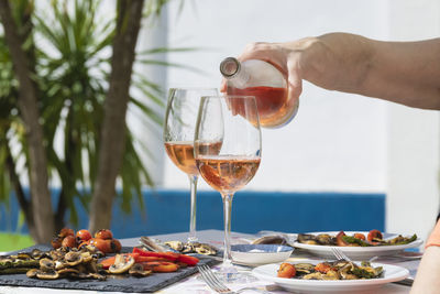 Cropped hand of woman holding wineglass