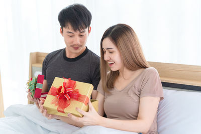 Young couple sitting on table