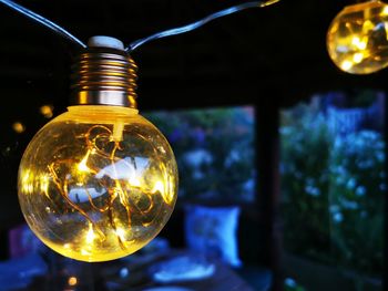 Close-up of illuminated light bulb