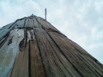 Low angle view of wooden structure against sky