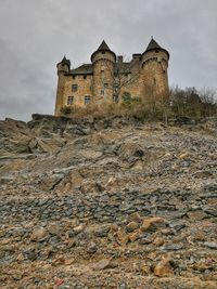 Low angle view of historic building against cloudy sky