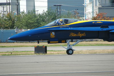 View of airplane at airport runway