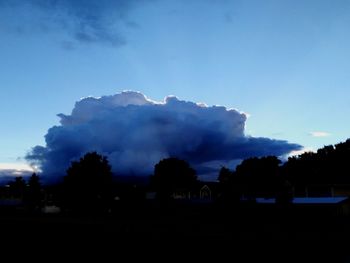 Silhouette landscape against dramatic sky