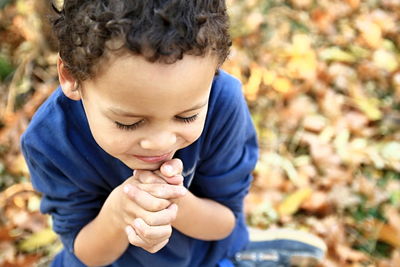 Portrait of boy looking away outdoors