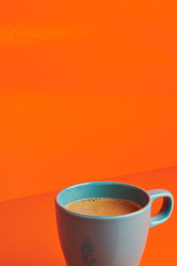 Close-up of coffee cup on table