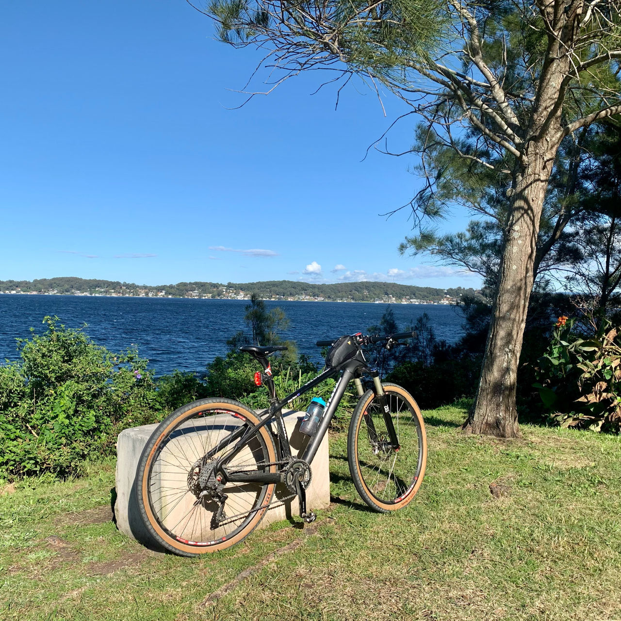 BICYCLES ON LAND AGAINST SKY