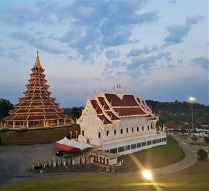 View of temple building against cloudy sky