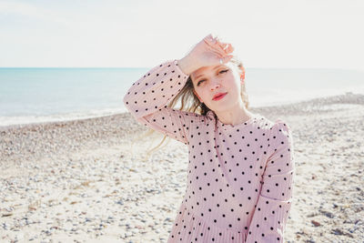 Portrait of a woman standing on beach