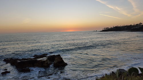 Scenic view of sea at sunset