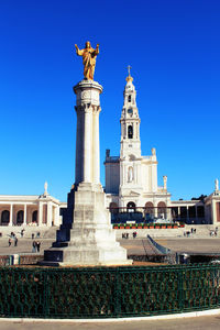 Low angle view of building against clear blue sky