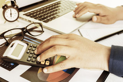 High angle view of person using smart phone on table