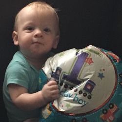 Portrait of cute boy holding camera