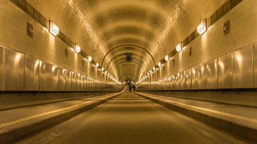 Man in illuminated corridor