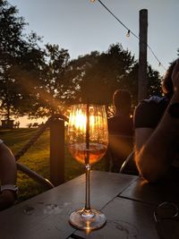 People on table at sunset