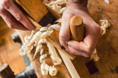 High angle view of man working on wood