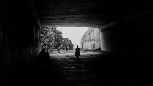 Silhouette of man in tunnel
