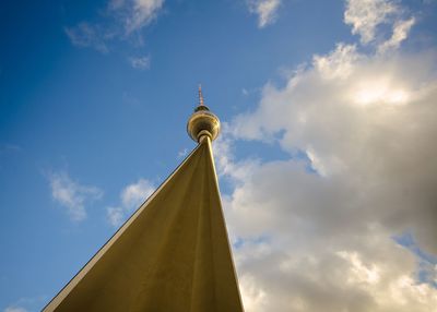 Low angle view of tower against cloudy sky